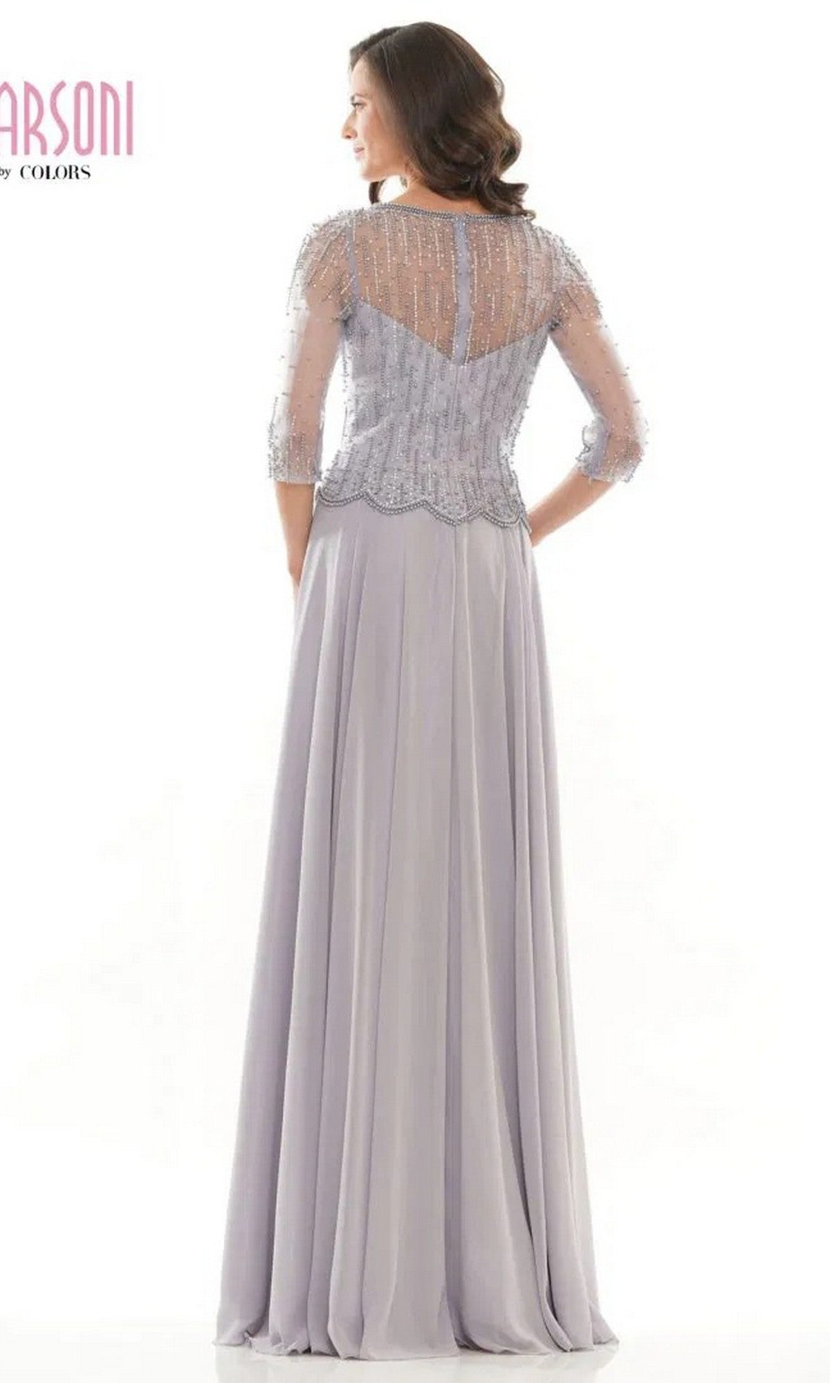 A woman is shown from the back wearing the Marsoni M312 long formal dress, featuring a light lavender color, beaded bodice, sheer top, and flowing A-line skirt against a white background.